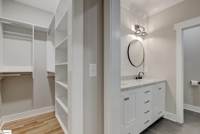 bathroom featuring vanity and hardwood / wood-style flooring