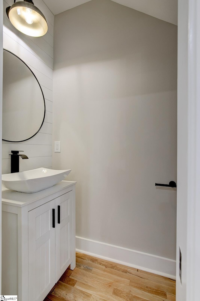 bathroom featuring hardwood / wood-style floors and vanity