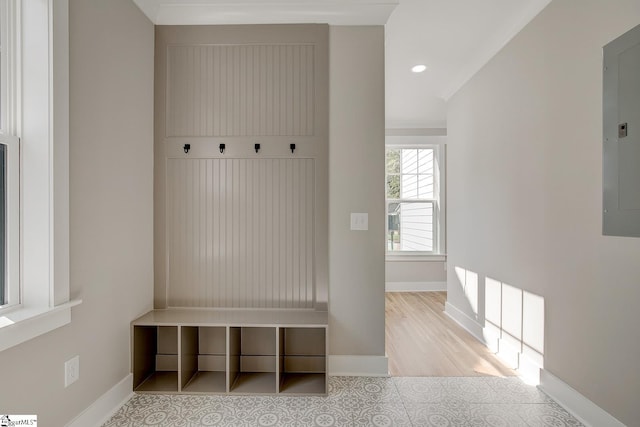 mudroom with light wood-type flooring and electric panel