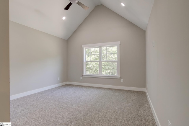 spare room featuring carpet floors, ceiling fan, and high vaulted ceiling