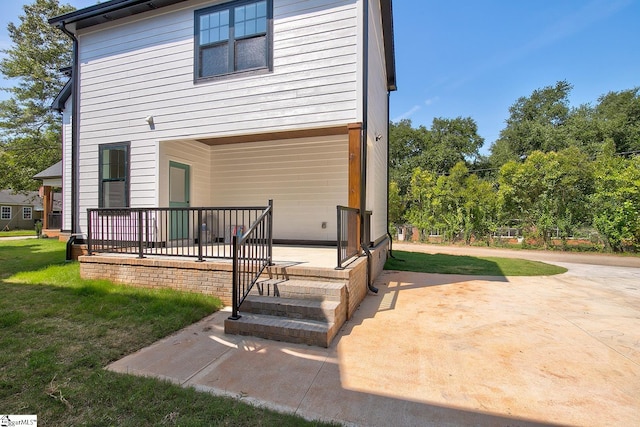 rear view of property featuring a yard