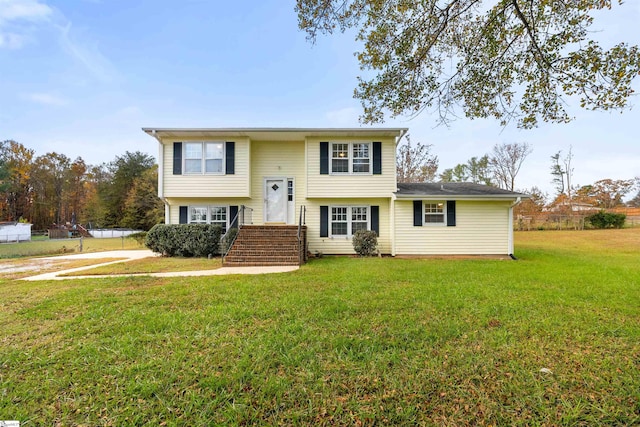 raised ranch featuring a front yard