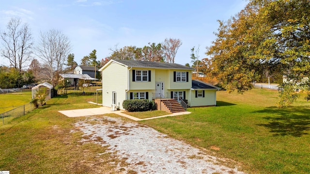 raised ranch with a front lawn