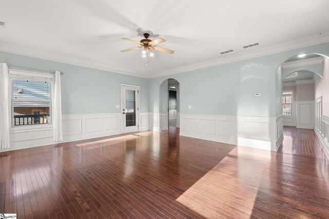 spare room with hardwood / wood-style flooring, ceiling fan, and crown molding