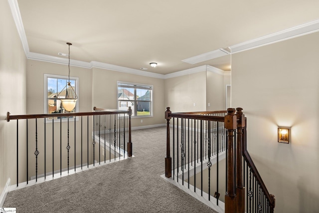 hallway with carpet floors, a wealth of natural light, and crown molding