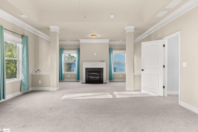 unfurnished living room with light carpet, crown molding, and a healthy amount of sunlight