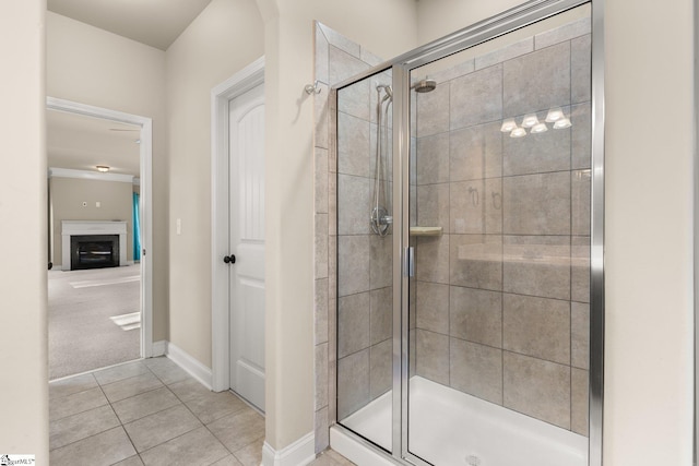 bathroom with tile patterned floors and a shower with shower door