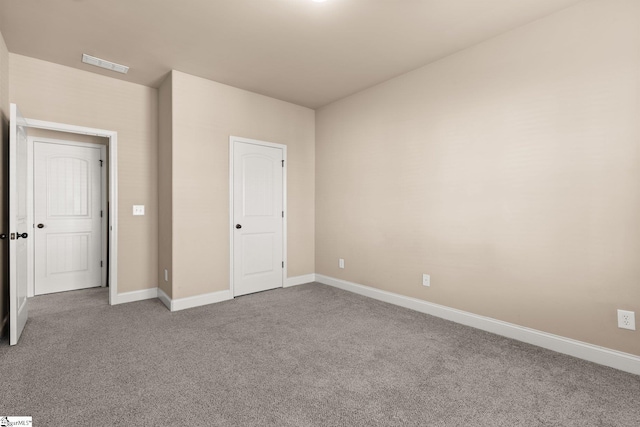 unfurnished bedroom featuring carpet