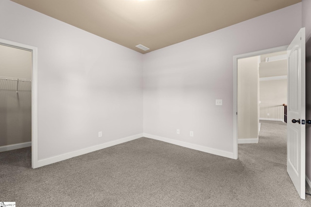 unfurnished room featuring carpet