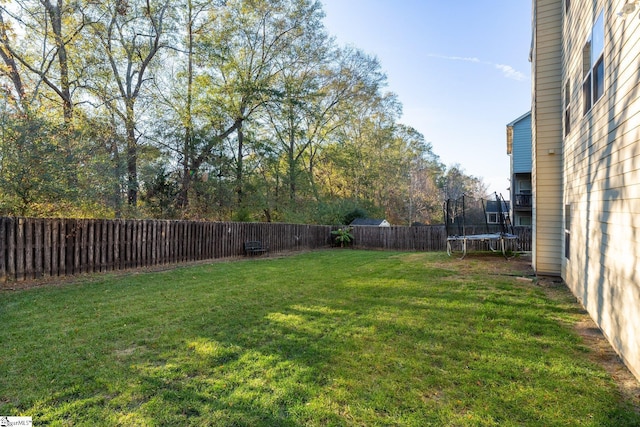 view of yard with a trampoline