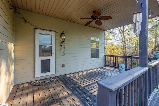 wooden terrace featuring ceiling fan