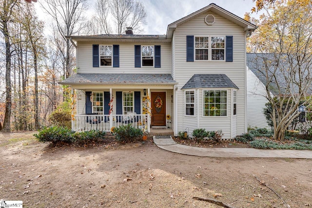 view of property featuring covered porch