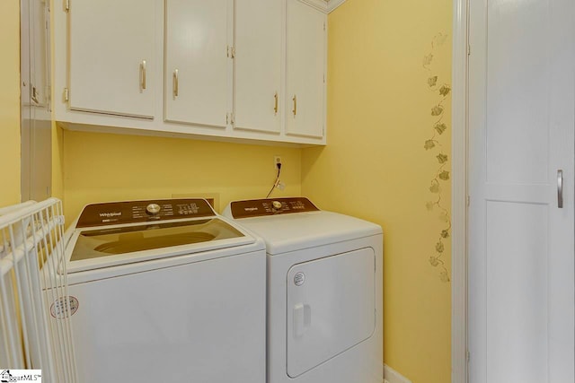 laundry room featuring cabinets and independent washer and dryer