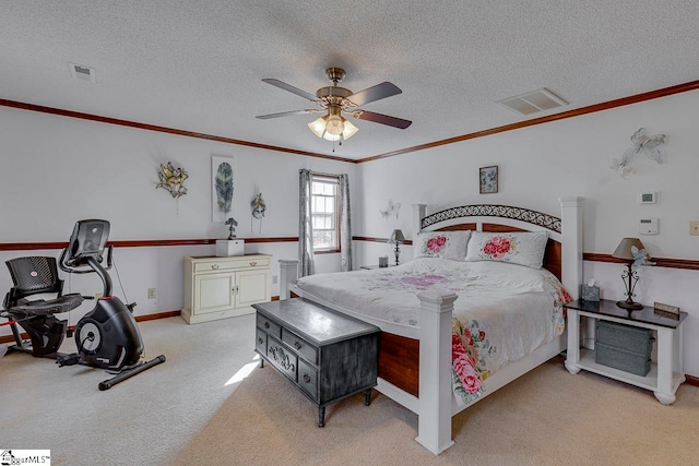 carpeted bedroom featuring ceiling fan, a textured ceiling, and ornamental molding