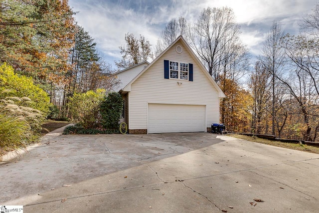 view of side of home featuring a garage