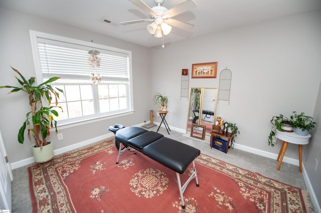 workout area with carpet and ceiling fan