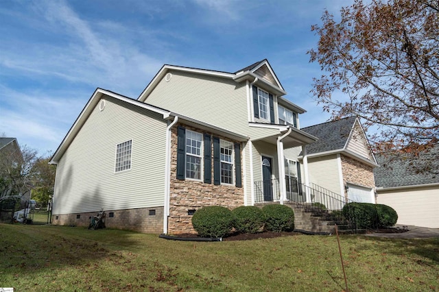 view of front of home with a garage and a front yard