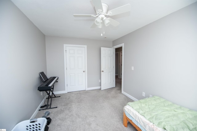 carpeted bedroom featuring ceiling fan