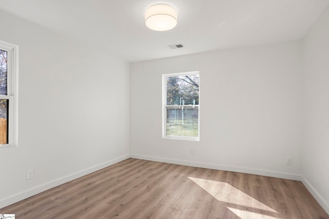 unfurnished room featuring light wood-type flooring