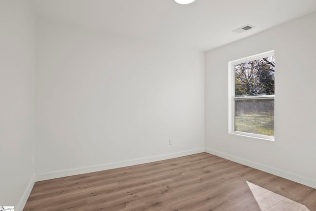 empty room with light hardwood / wood-style floors