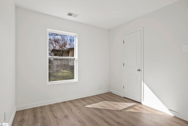 unfurnished room featuring light wood-type flooring