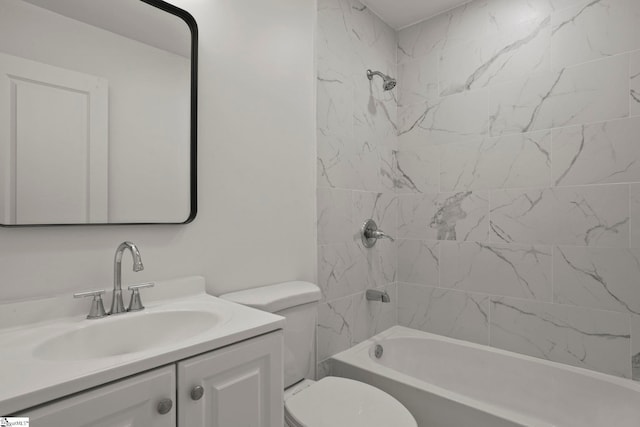 full bathroom featuring vanity, tiled shower / bath combo, and toilet