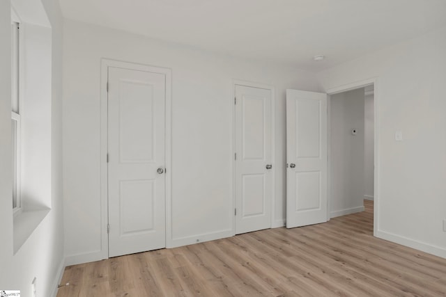 unfurnished bedroom with light hardwood / wood-style flooring