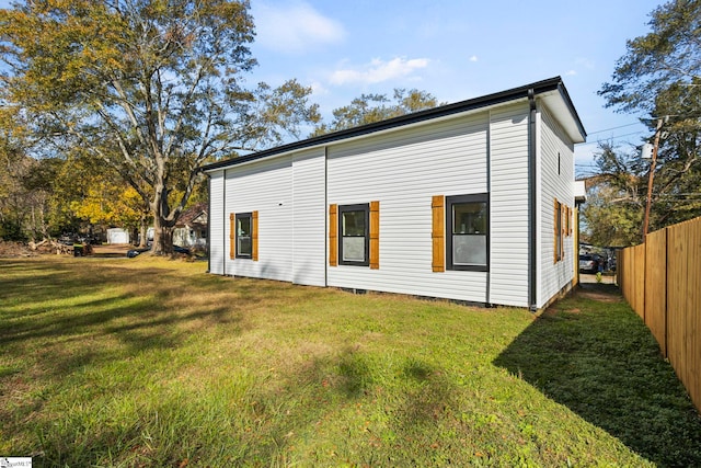 rear view of house with a lawn