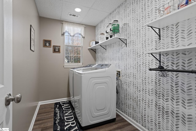 washroom featuring washer and dryer and dark wood-type flooring