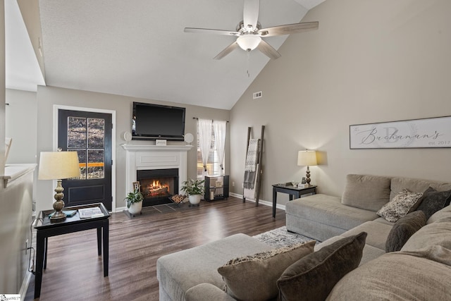 living room featuring ceiling fan, dark hardwood / wood-style flooring, and high vaulted ceiling