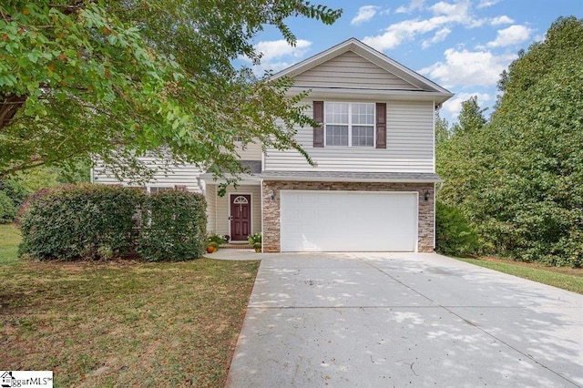 front of property featuring a garage and a front lawn