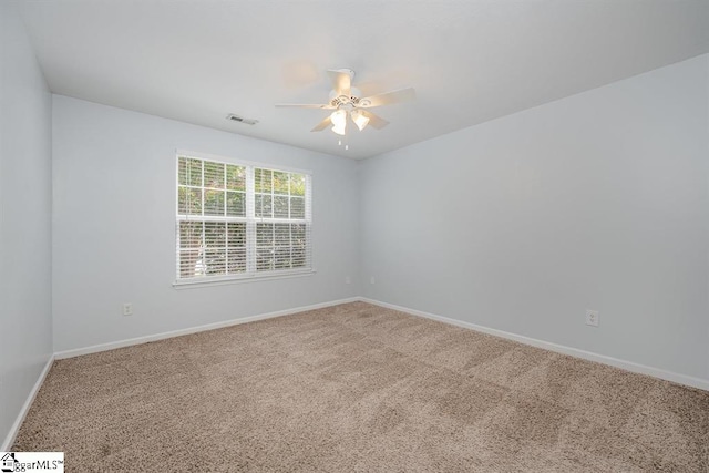 carpeted empty room with ceiling fan