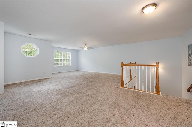 carpeted empty room with ceiling fan