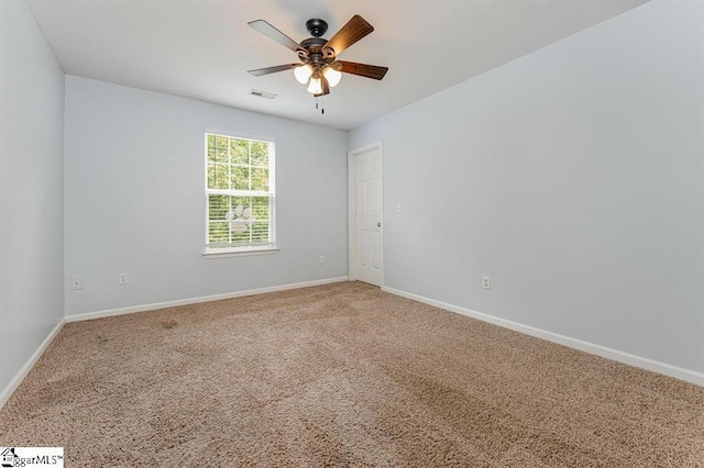 unfurnished room featuring carpet and ceiling fan