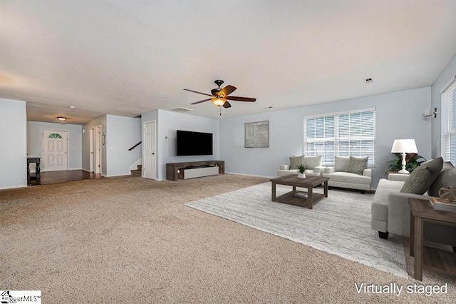 living room with carpet flooring and ceiling fan