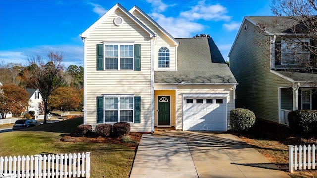 front facade featuring a garage and a front yard