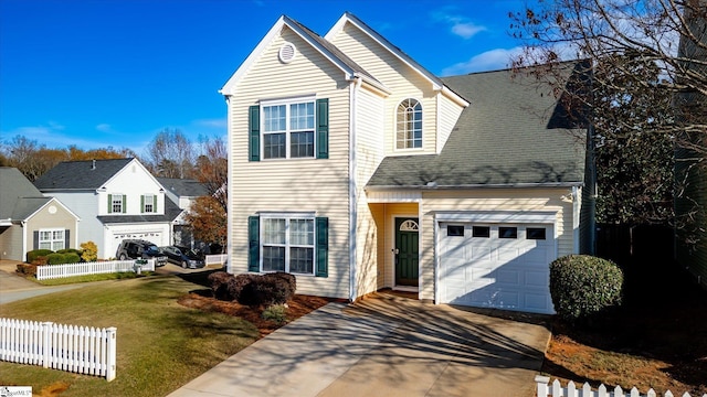 front facade with a garage and a front lawn