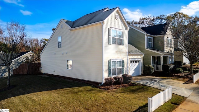 view of home's exterior with a garage and a lawn