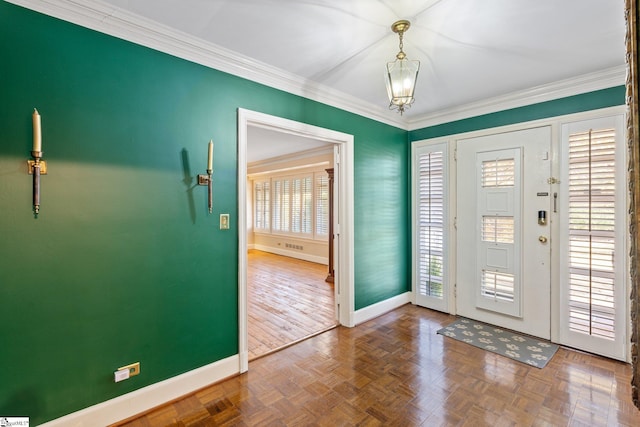 entryway featuring a notable chandelier, ornamental molding, and parquet floors