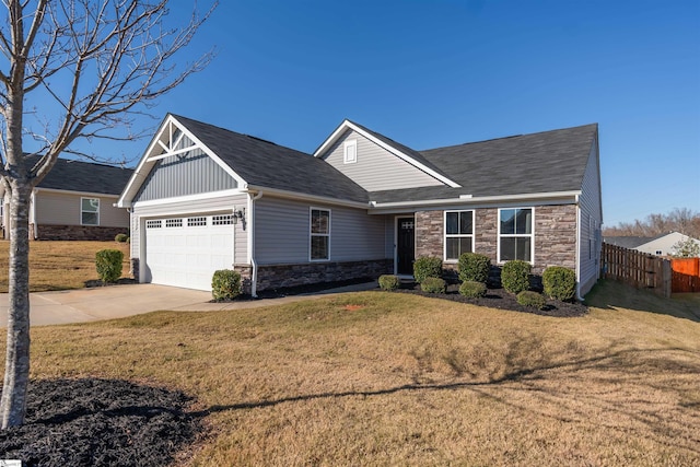 view of front of home featuring a garage and a front lawn