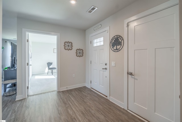 entryway with hardwood / wood-style floors