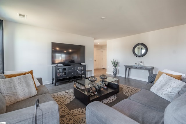 living room featuring dark hardwood / wood-style flooring