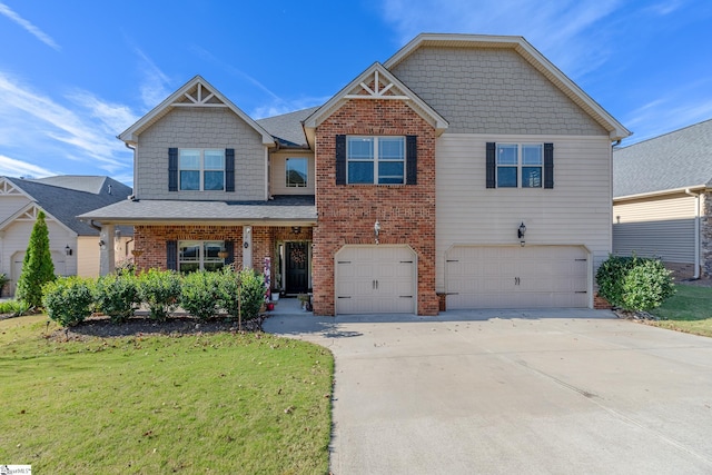 view of front of house with a front yard and a garage