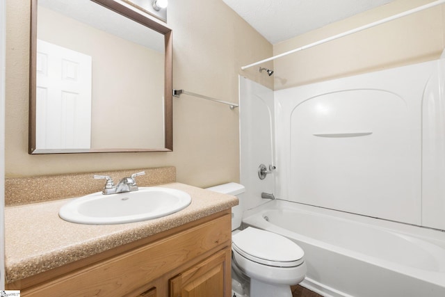 full bathroom with toilet, vanity, a textured ceiling, and washtub / shower combination