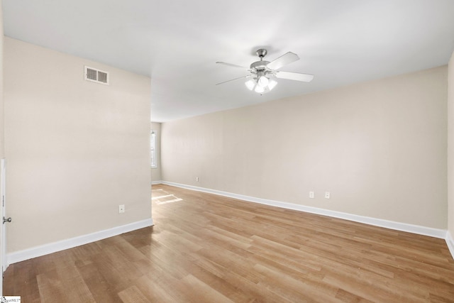 unfurnished room with light wood-type flooring and ceiling fan