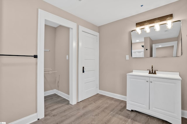 bathroom featuring vanity and wood-type flooring