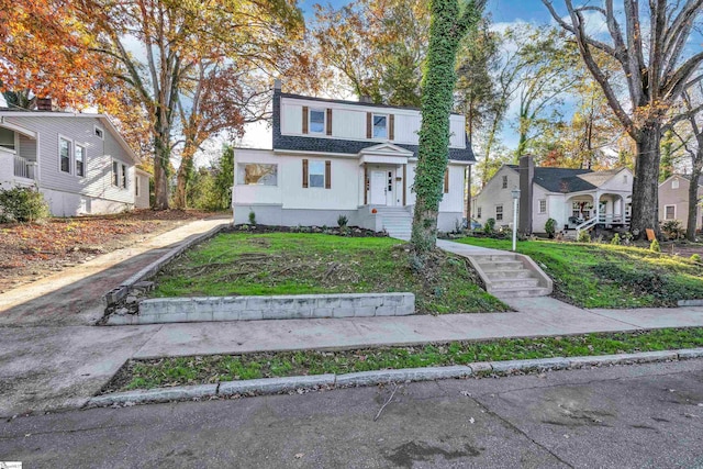 view of front of house with a front lawn