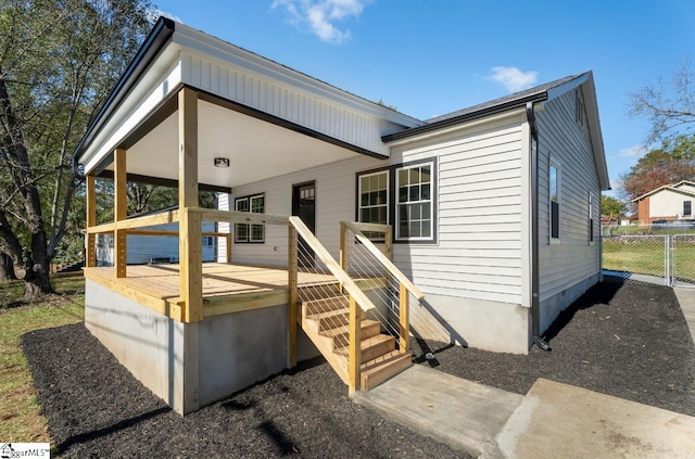 back of house with covered porch