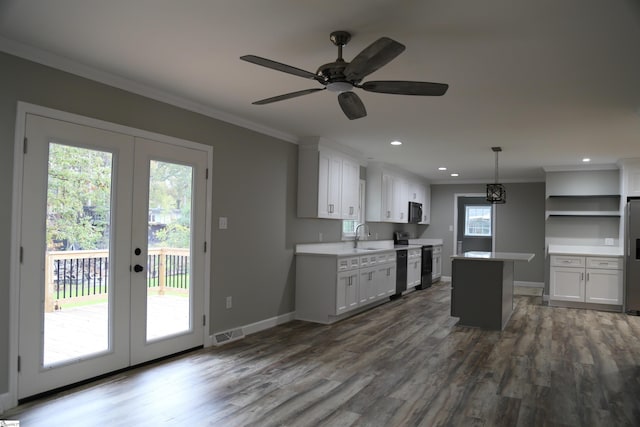 kitchen with white cabinetry, french doors, a center island, and black appliances