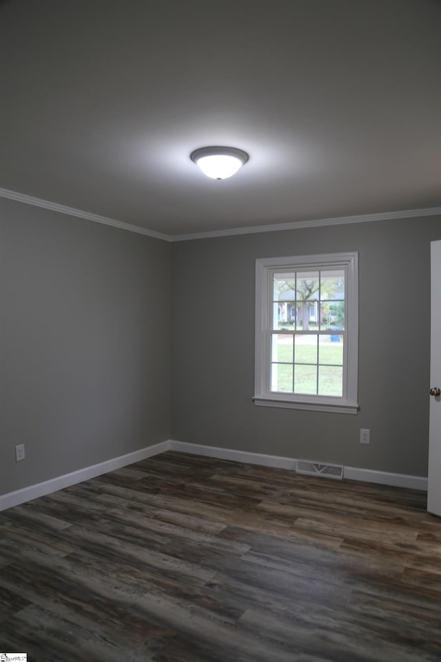 unfurnished room with dark hardwood / wood-style flooring and crown molding